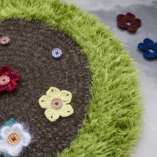 Дидактический вязанный коврик "Полянка"