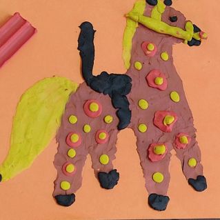 Лошадка с седлом дымковская игрушка