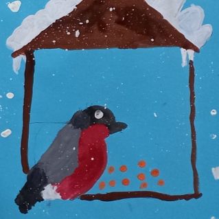 Снегирь на кормушке.