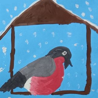 Снегирь на кормушке.