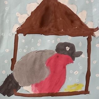 Снегирь на кормушке.