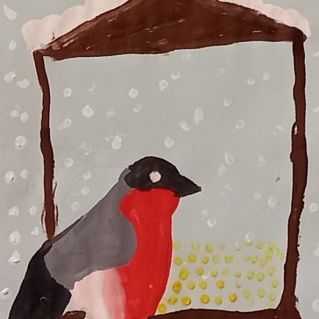 Снегирь на кормушке.