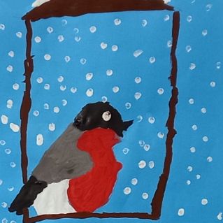 Снегирь на кормушке.