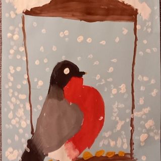 Снегирь на кормушке.