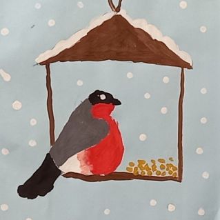 Снегирь на кормушке.