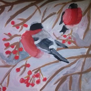 Снегири на ветке рябины.