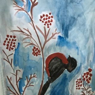 Снегирь лакомится рябиной