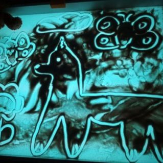 "Собачка", песочная картина