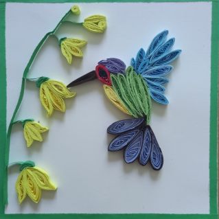 Колибри на цветке